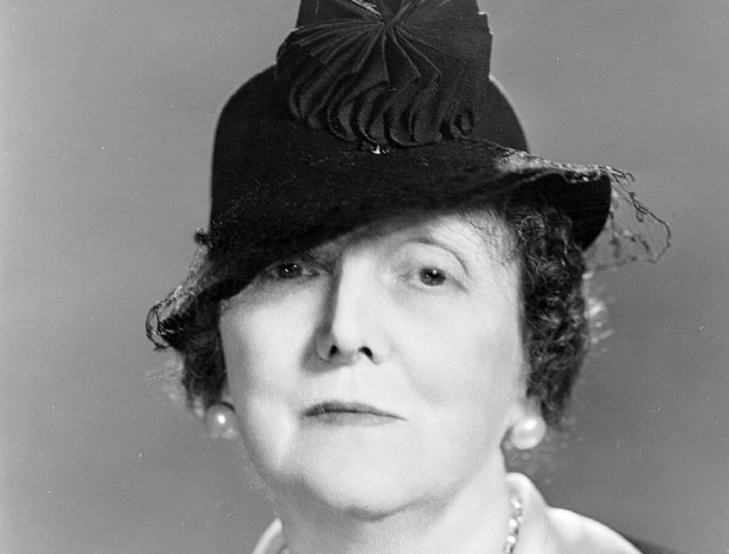Emily Post, one of the pioneering women of the auto industry, sports a fancy hat. 