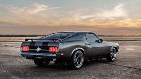 A gray and black 1969 Ford Mustang "Hitman" shows off its Boss 429 and Mach 1-inspired rear-end was featured in the Keanu Reeves 'John Wick' franchise.