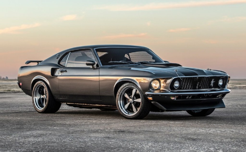 A gray and black 1969 Ford Mustang "Hitman" shows off its Boss 429 and Mach 1-inspired rear-end was featured in the Keanu Reeves John Wick franchise.