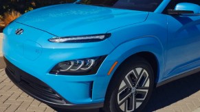 The front of a blue 2023 Hyundai Kona Electric subcompact electric SUV.