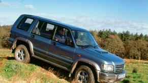 The second-generation Isuzu Trooper drives off-road.