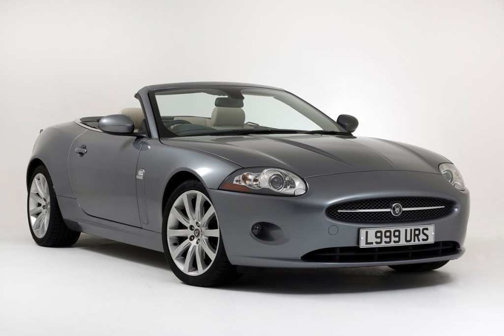 A X150 Jaguar XK, like the XKR, shows off its GT car lines and convertible top. 