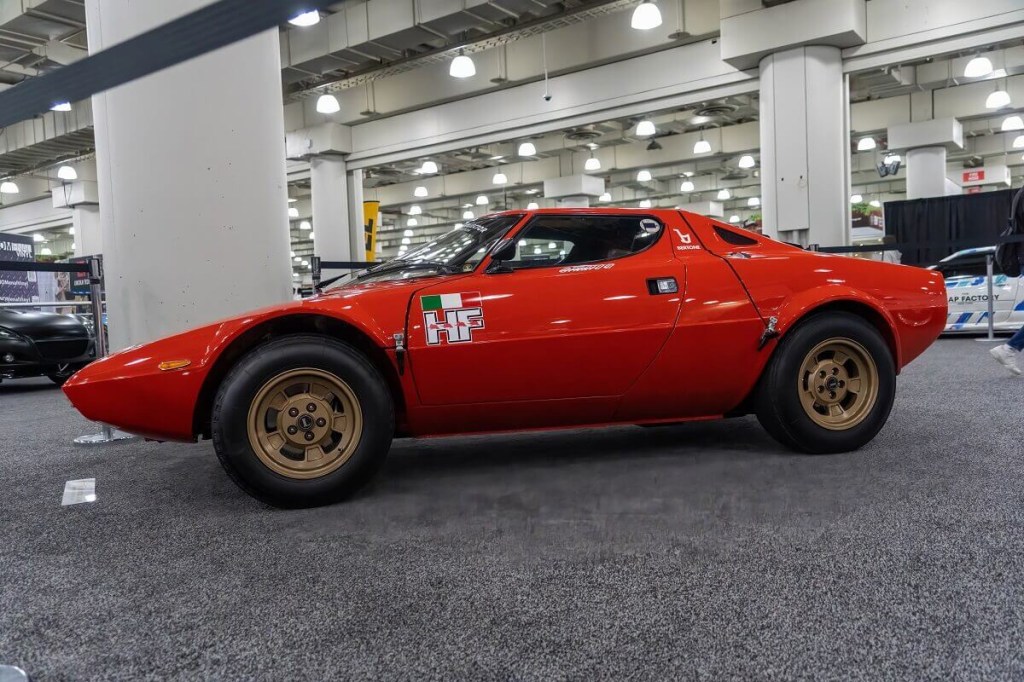 A 1974 Lancia Stratos rally car poses at the New York International Auto Show.