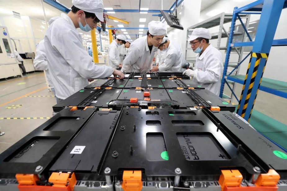 Factory workers in China assemble a Li-ion battery for an EV out of Lithium.
