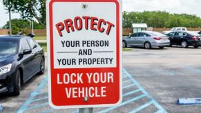 A sign reminds patrons to lock their vehicles to defend against stolen cars and property that could lead to branded or salvage titles.