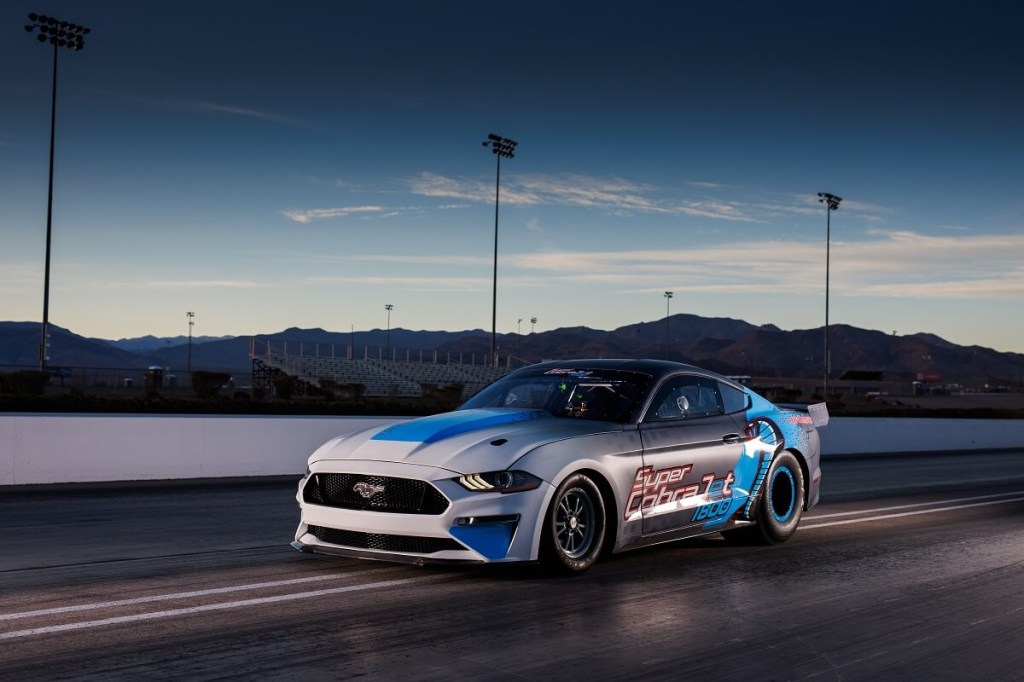 The all-electric Ford Mustang Super Cobra Jet 1800 sits on a drag strip. 