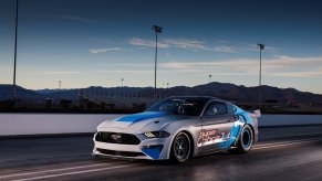 The all-electric Ford Mustang Super Cobra Jet 1800 sits on a drag strip.