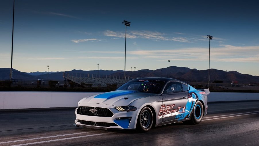 The all-electric Ford Mustang Super Cobra Jet 1800 sits on a drag strip.