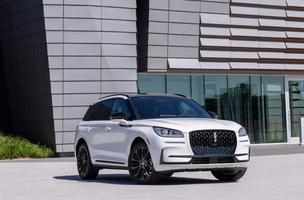 The new 2023 Lincoln Corsair Reserve on display in front of a modern building. Owners love many things about this luxury compact Lincoln SUV