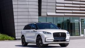 The new 2023 Lincoln Corsair Reserve on display in front of a modern building. Owners love many things about this luxury compact Lincoln SUV