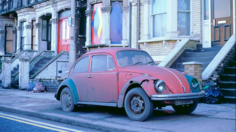 An old and rusted Volkswagen Beetle