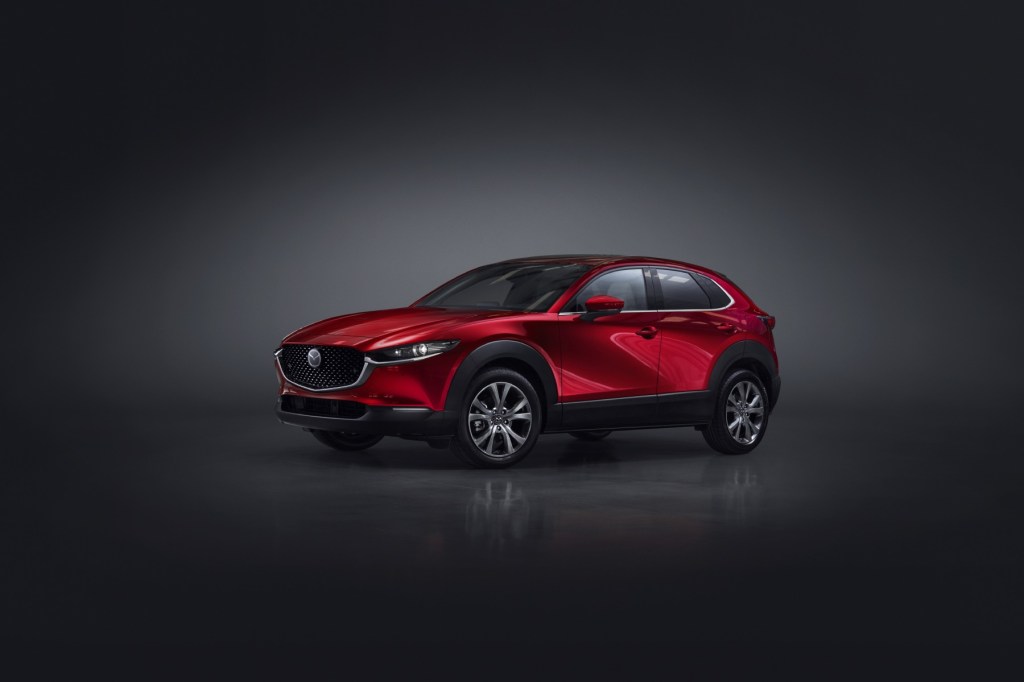 2023 Mazda CX-30 in red on a dark background. 