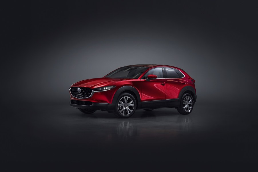 2023 Mazda CX-30 in red on a dark background.