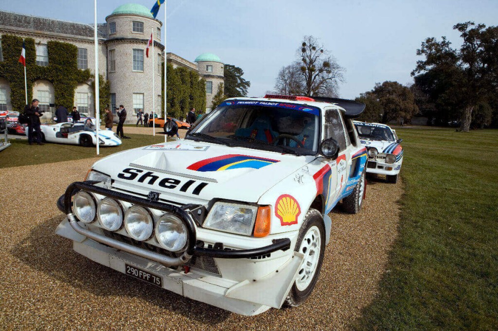 A Peugeot 205 T16 with rally livery shows off.