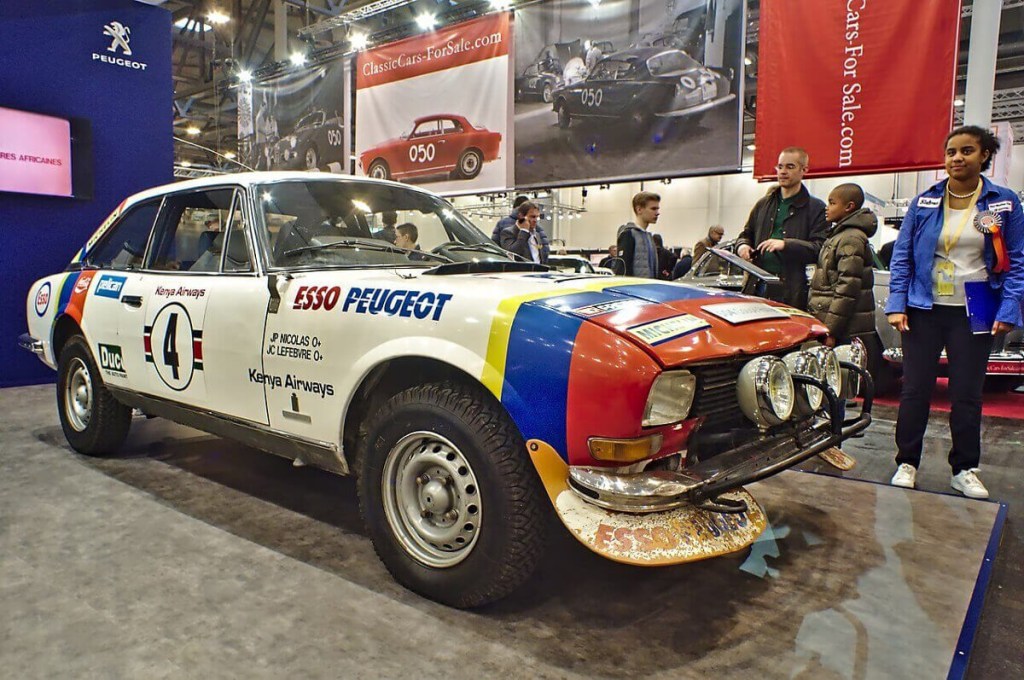 A Peugeot 504 Group B rally car sits on display.