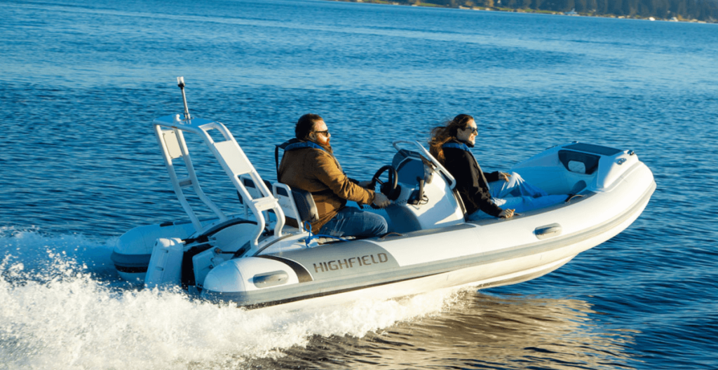 Pure Watercraft RIB Sport 420 with two passengers on open sea