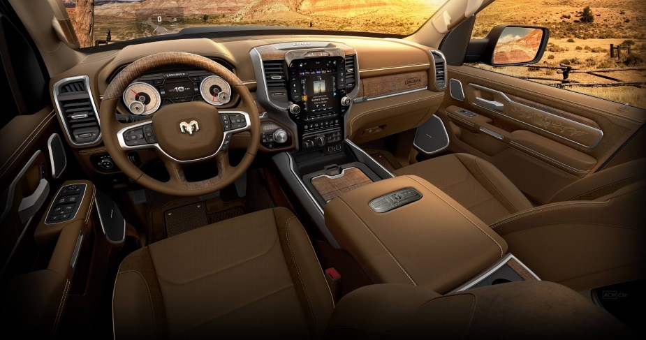 The interior of Ram's luxurious Limited Longhorn trim pickup truck with brown leather and open pore wood.