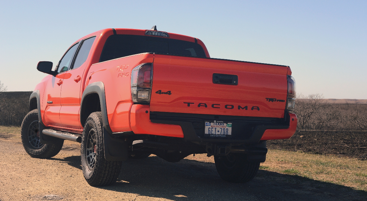 A red 2023 Toyota Tacoma TRD Pro midsize truck sits parked.