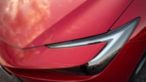 A red Toyota Prius headlight, which is one of the most reliable used cars for the money.
