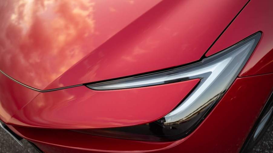 A red Toyota Prius headlight, which is one of the most reliable used cars for the money.