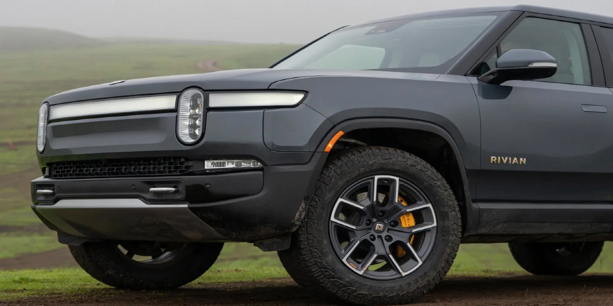 A gray 2023 Rivian R1S full-size luxury electric SUV is parked.