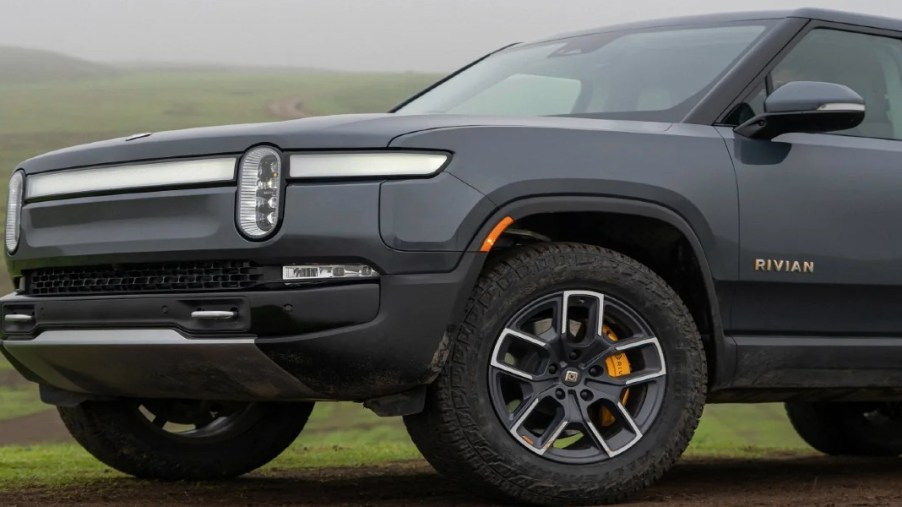 A gray 2023 Rivian R1S full-size luxury electric SUV is parked.