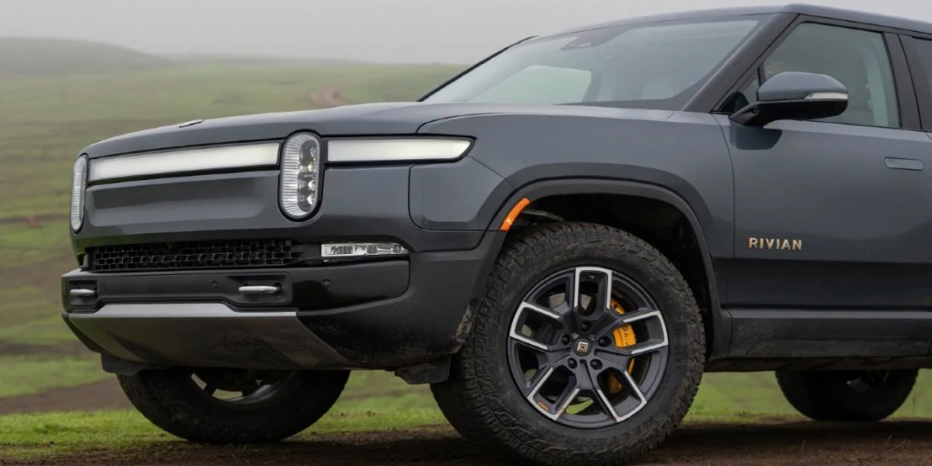The front of a gray 2023 Rivian R1S full-size electric SUV.