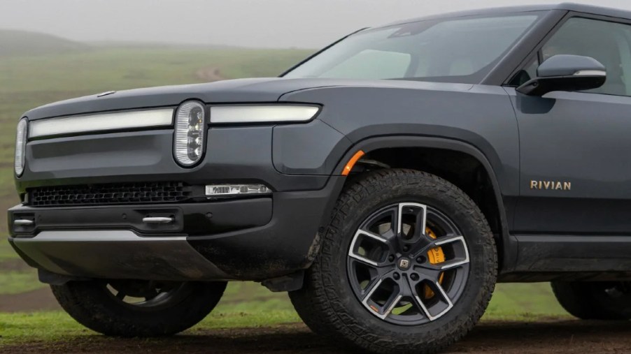 The front of a gray 2023 Rivian R1S full-size electric SUV.