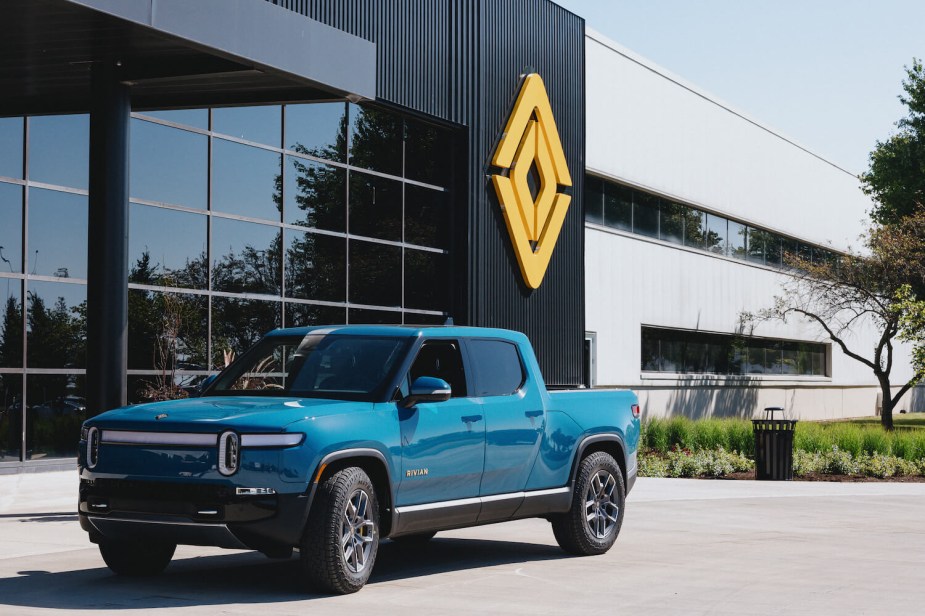 The blue Rivian electric truck parked in front of the company's factory in Normal, Illinois.