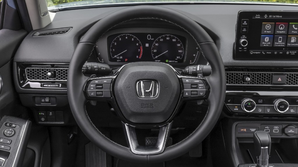 Steering wheel in 2023 Honda Civic, highlighting lawsuit for sticky steering wheel that gets stuck