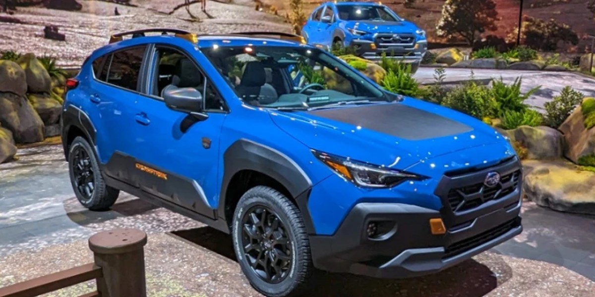 A blue 2024 Subaru Crosstrek Wilderness is parked at the New York International Auto Show.
