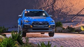 A blue 2023 Subaru Crosstrek Wilderness is parked.