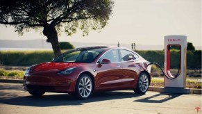 Tesla Model 3 Plugged into a Public Tesla Supercharger