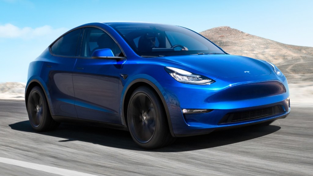 Tesla Model Y Driving on a Country Road