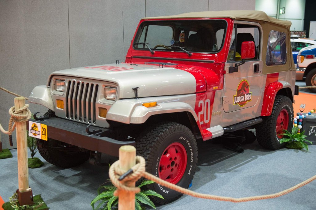 A Jurassic Park Jeep tribute sits on display at a car show. 