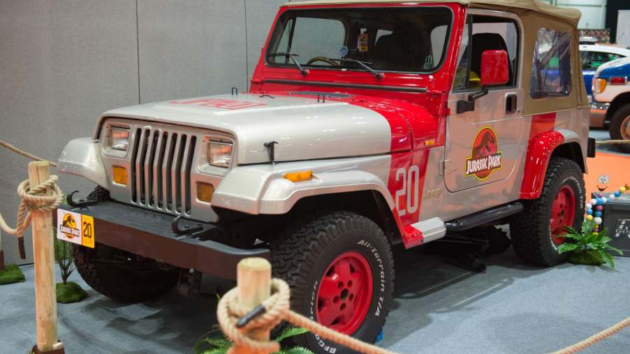 A Jurassic Park Jeep tribute sits on display at a car show.