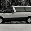 A black and white photo of a Toyota Previa.