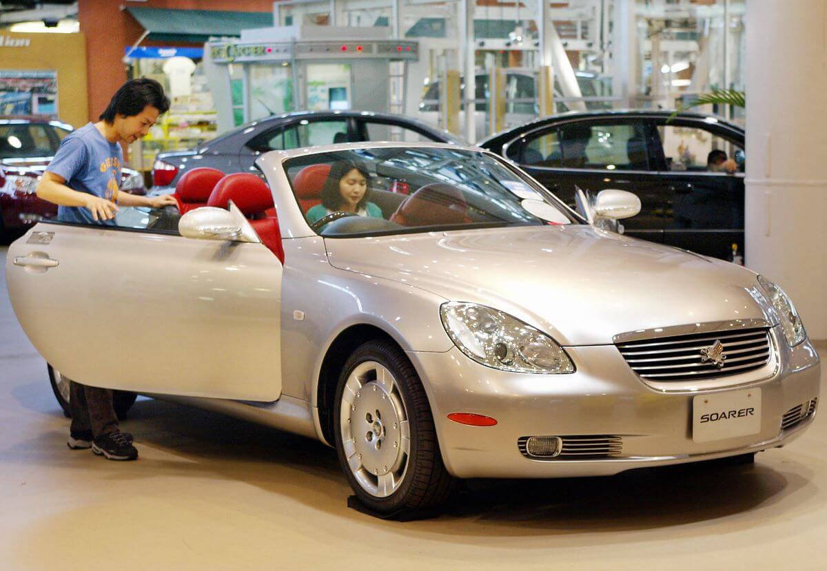 A white-silver Toyota Soarer hardtop convertible coupe sports car model in Tokyo, Japan