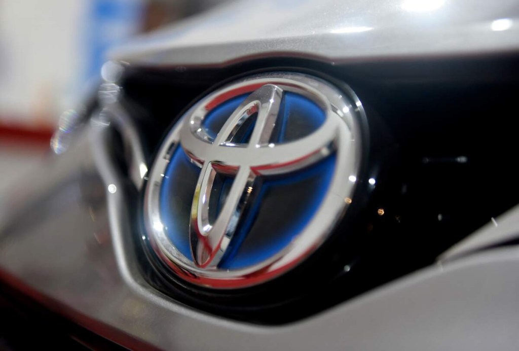 A Toyota logo, which the 2023 Toyota reliability still remains strong, on the grille of a car. 