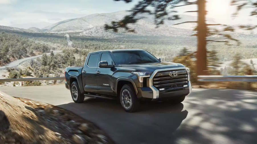 A 2023 Toyota Tundra is driving down the road as a full-size truck.