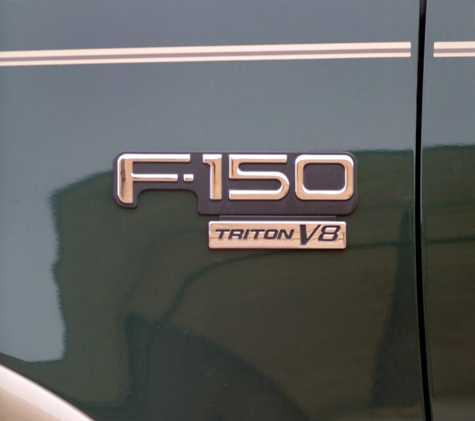 The 5.4-liter Triton V8 badge on a Ford F-150 truck.