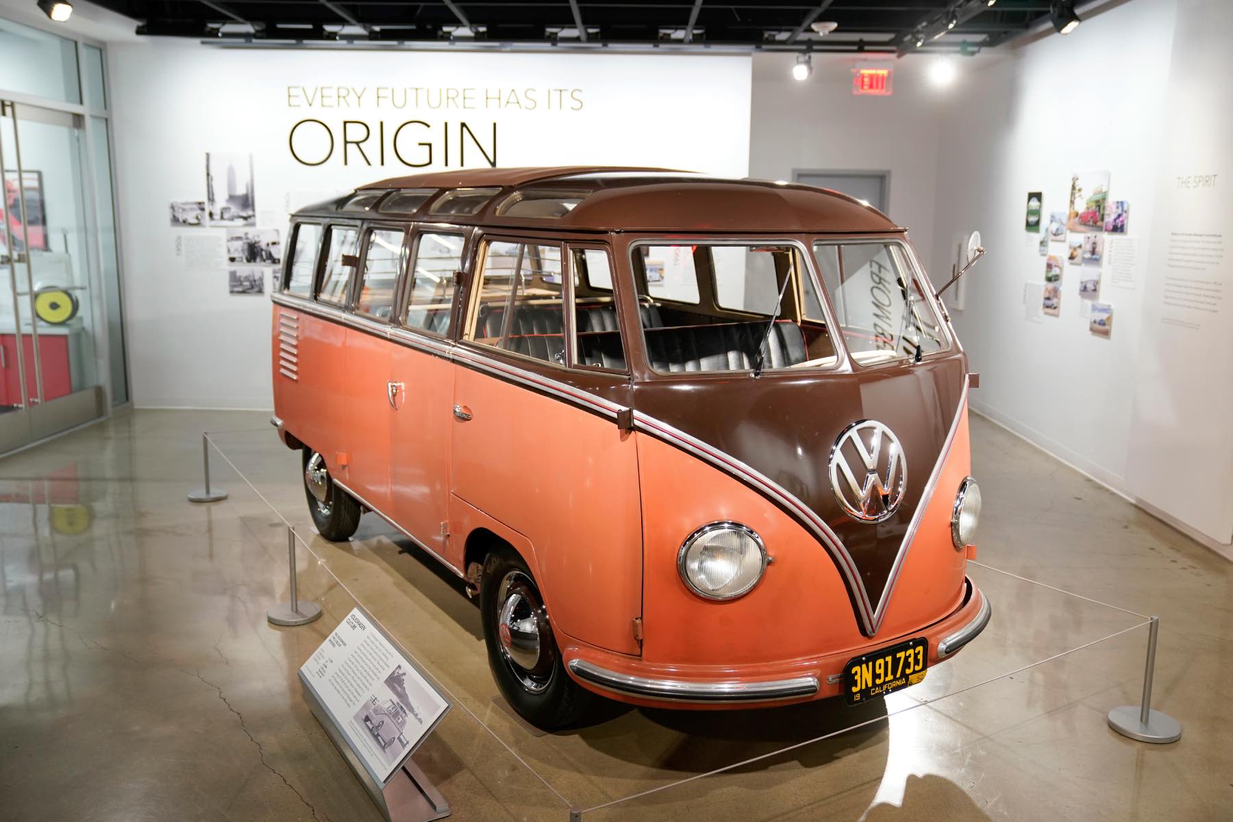 A vintage VW Bus on display at an event.