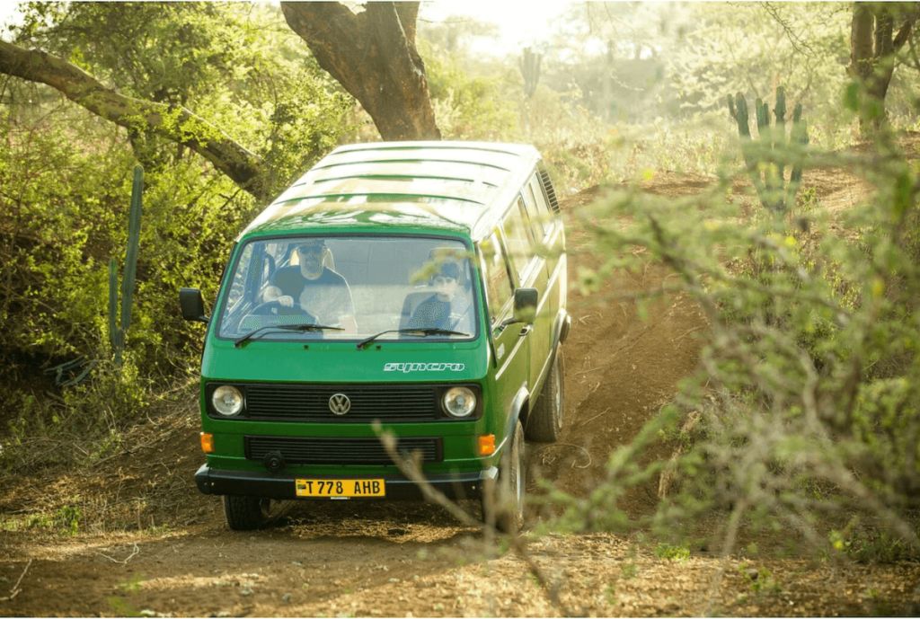 Rare Volkswagen van driving down a hill.