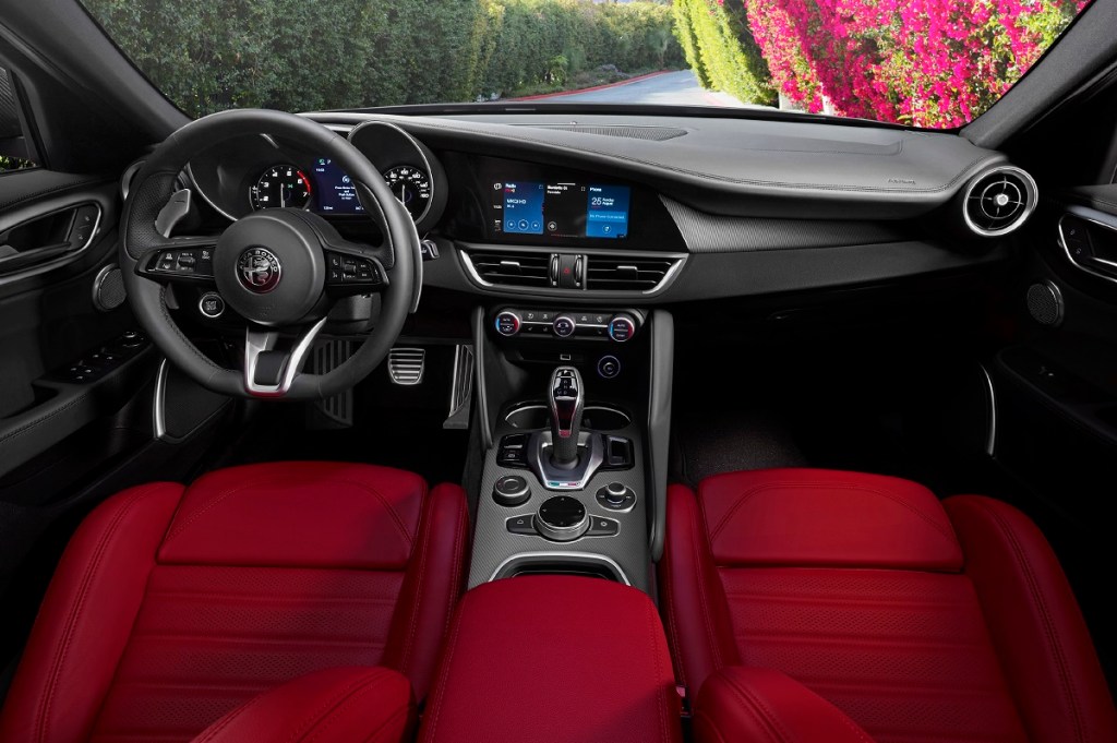 The interior of the Alfa Romero Giulia with red sport seats
