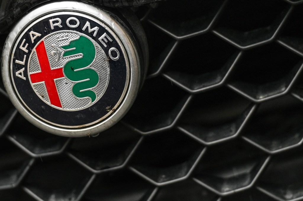 An Alfa Romeo logo showing the flag of Milan and a snake eating a man