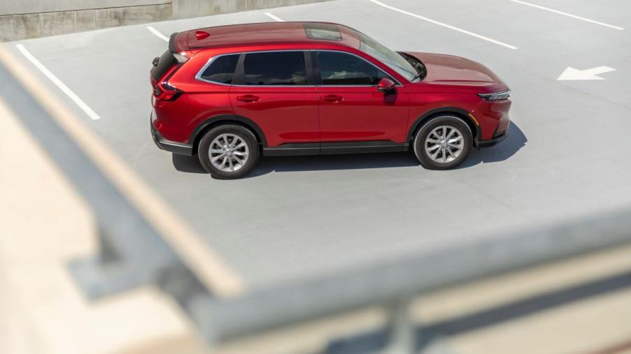 An overhead shot of a red 2023 Honda CR-V EX-L, the most reliable compact SUV model, parked on top of a parking garage
