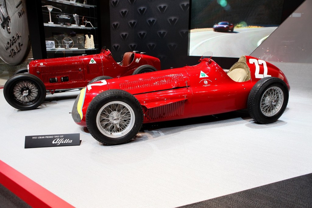 2 vintage Alfa Romeo race cars in red
