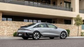 A rear and side profile shot of a gray 2023 Hyundai Ioniq 6 electric midsize fastback sedan model