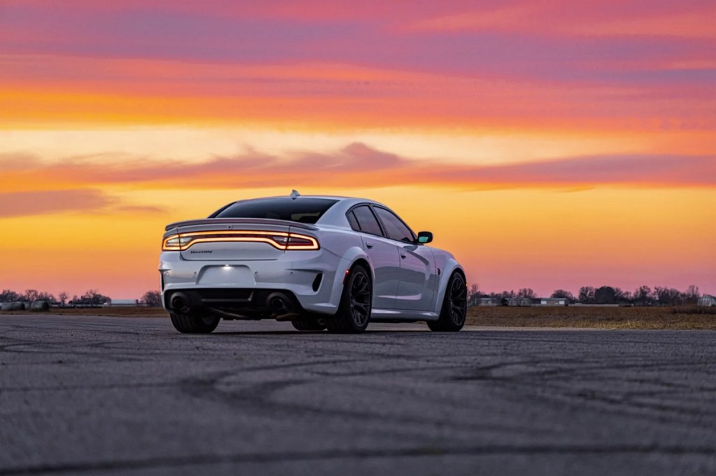 A Hennessey H1000 Hellcat Charger in white at sunset