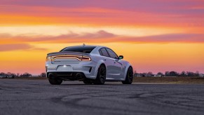 A Hennessey H1000 Hellcat Charger in white at sunset